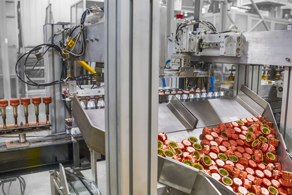 Inline metallization production line for Tito's vodka bottle caps at Spartek.